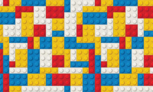 Kinderkamer behang met LEGO bouwstenen in primaire kleuren