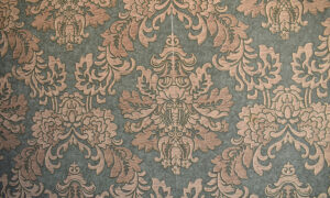 Behang met damast patroon in saliegroen